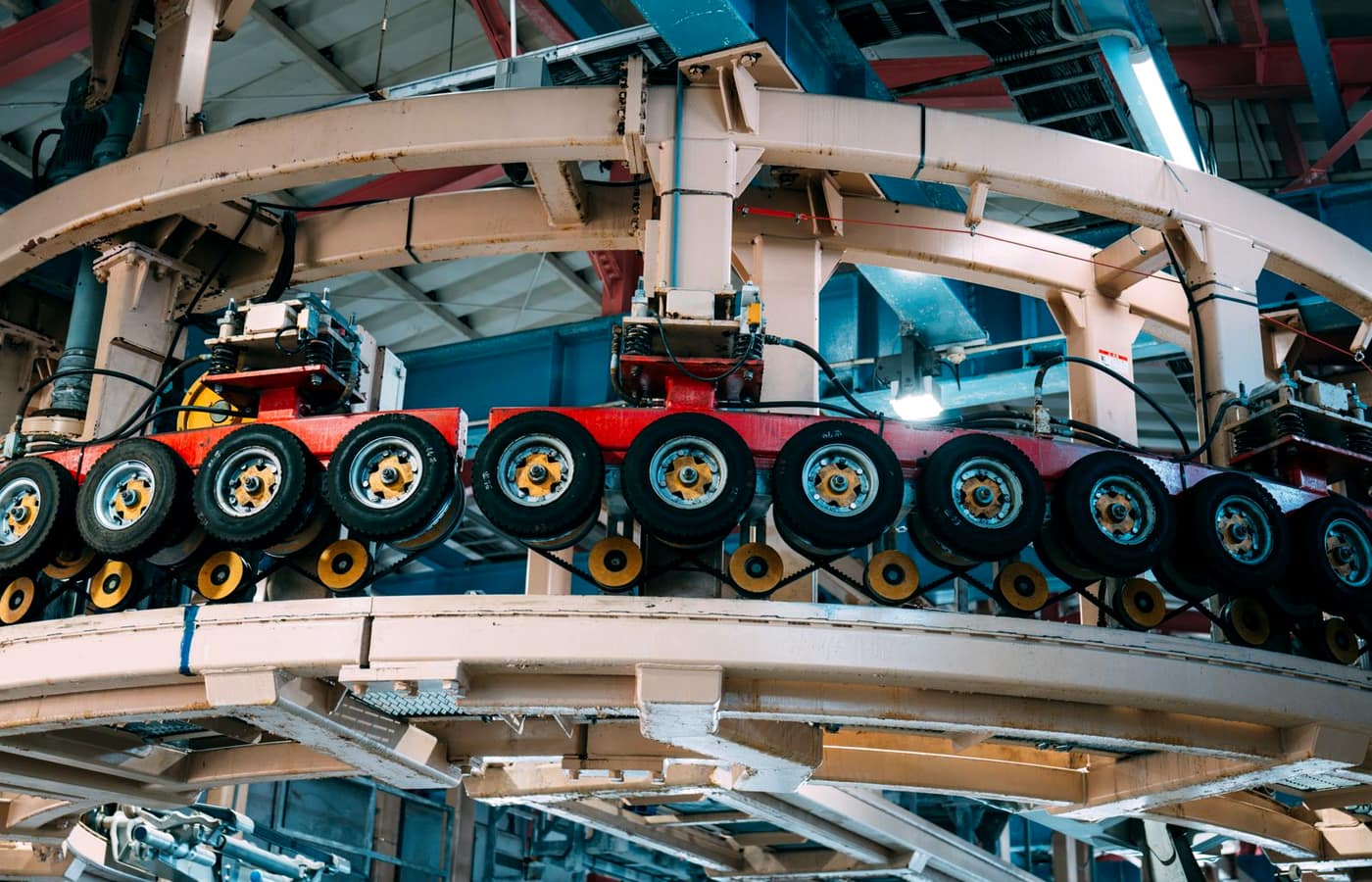 An industrial conveyor and roller system running through a plant
